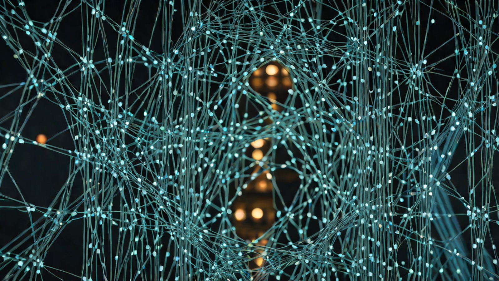 A user interacting with an AI in front of a computer screen, creating a complex web application in an instant.